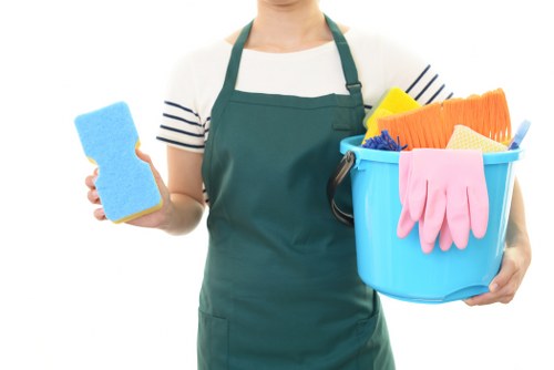 Cleaner preparing carpet cleaning equipment safely